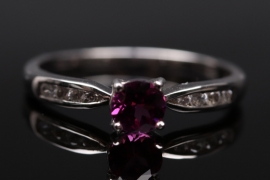 Silver ring with magenta colored garnet
