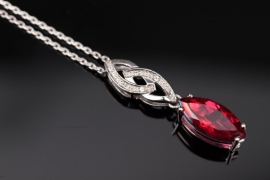 Silver necklace with deep pink topaz pendant