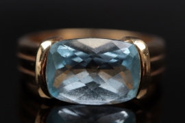 Silver ring with light blue topaz