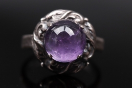 Silver ring with amethyst cabochon