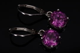 Silver earrings with magenta-colored cubic zirconias