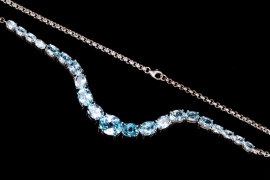 Silver necklace with light blue topazes