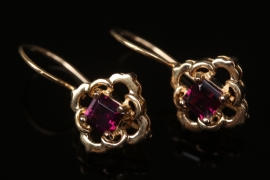 Gold plated silver earrings with magenta-colored garnets