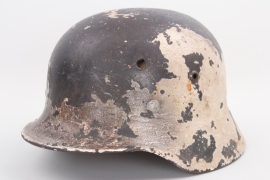 Wehrmacht M35 helmet with white winter camo - battle damaged