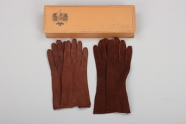 2 pairs of leather gloves in a case