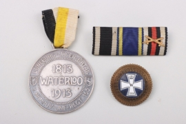 Two badges and a 3-place ribbon bar
