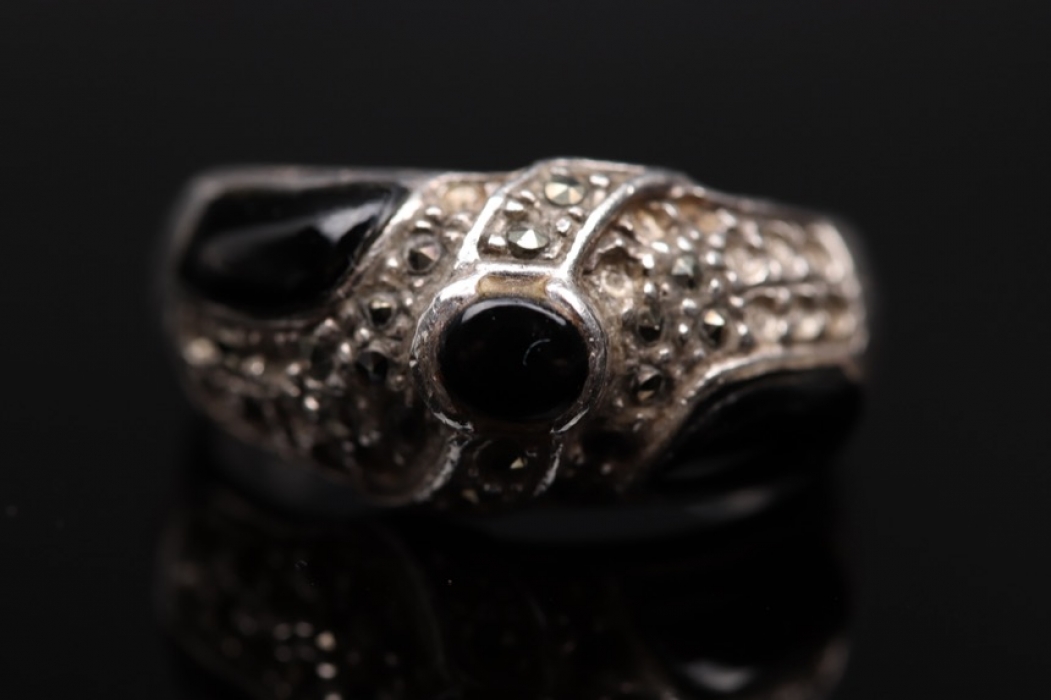 Silver ring with black gemstones