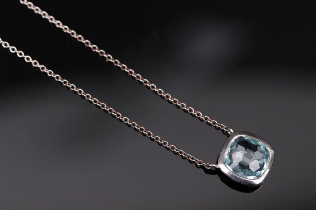 Silver necklace with light blue topaz