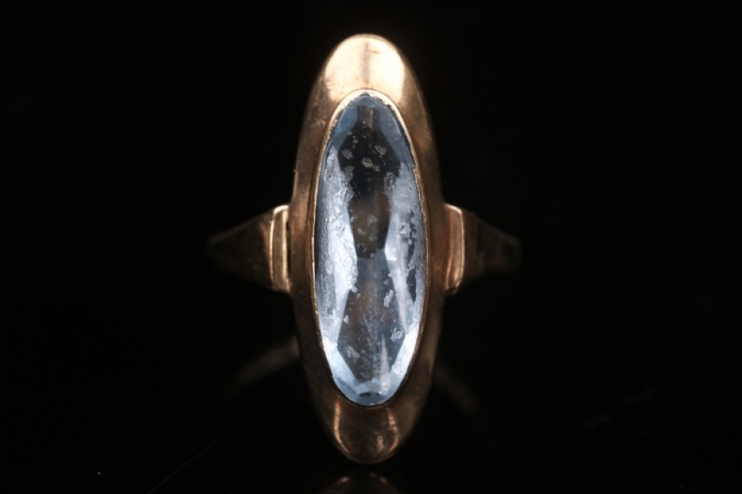 Golden ring with topaz
