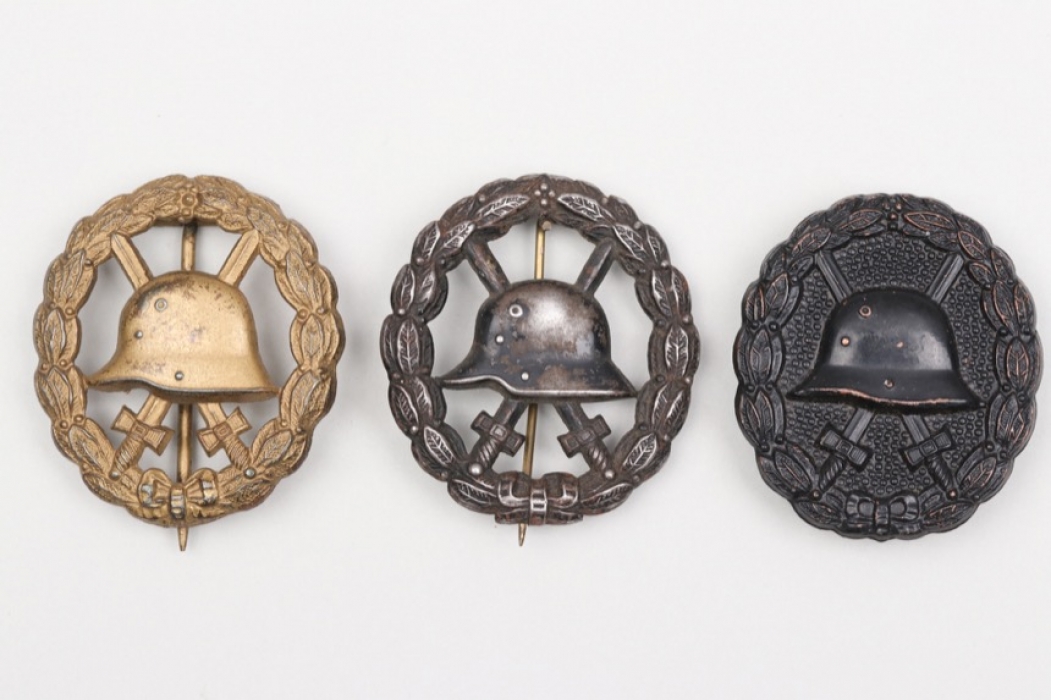 3 + WWI Wound Badges in gold and black