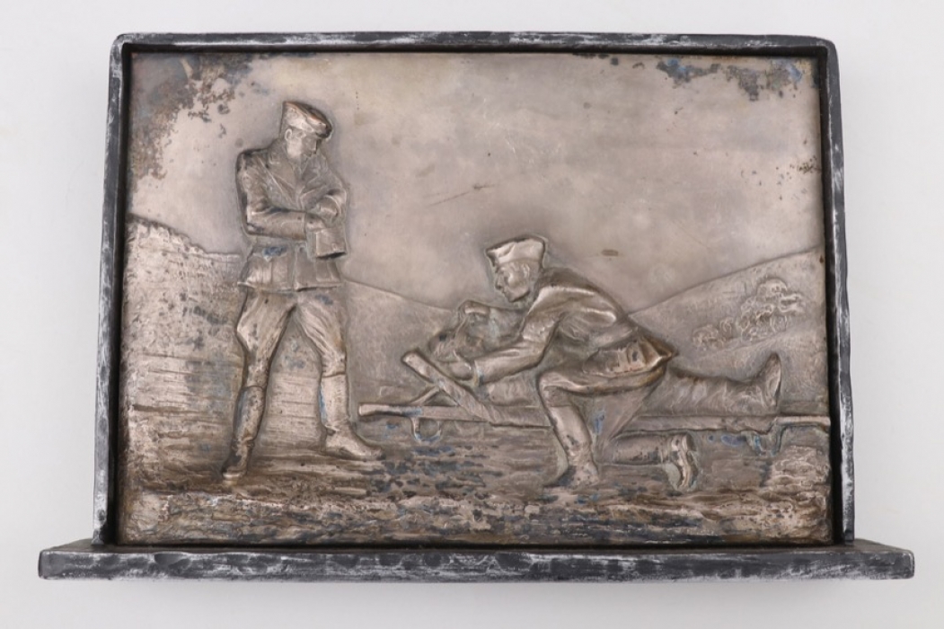 Framed relief with stand showing three soldiers