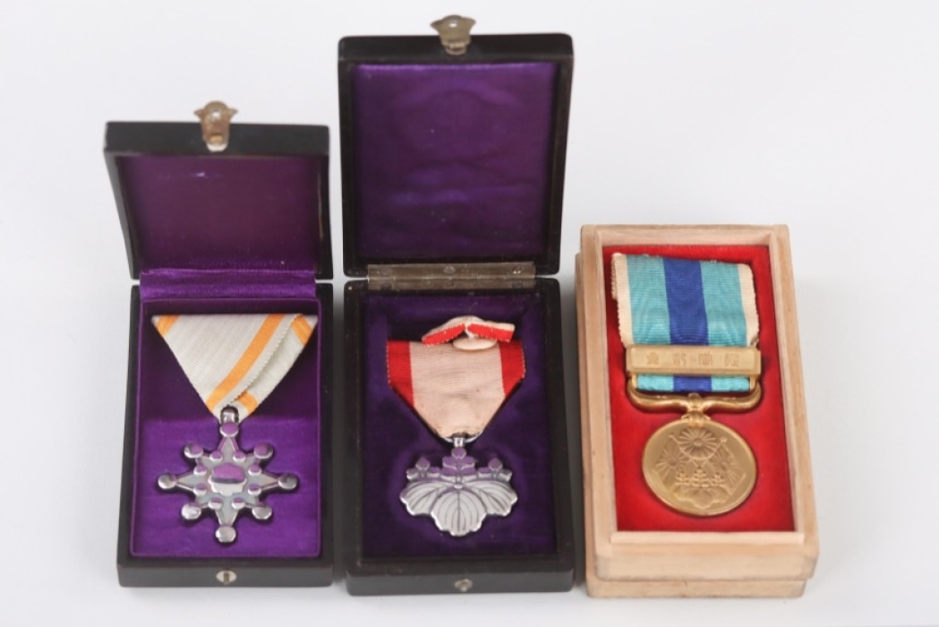Three Japanese medals with the cases of issue