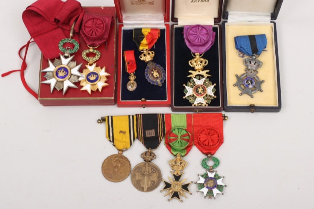 Lot of badges in case and a 4-place medal bar