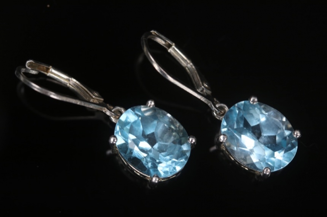 Silver earrings with light blue topazes