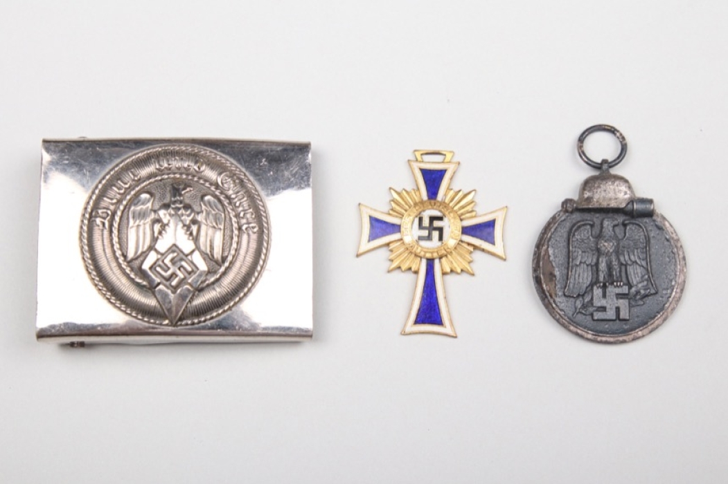 HJ buckle and two badges