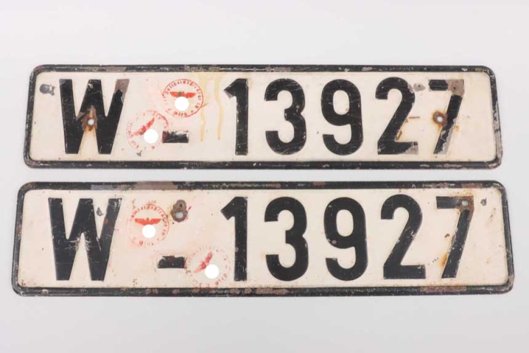 A pair of vehicle license plates "W-13927"